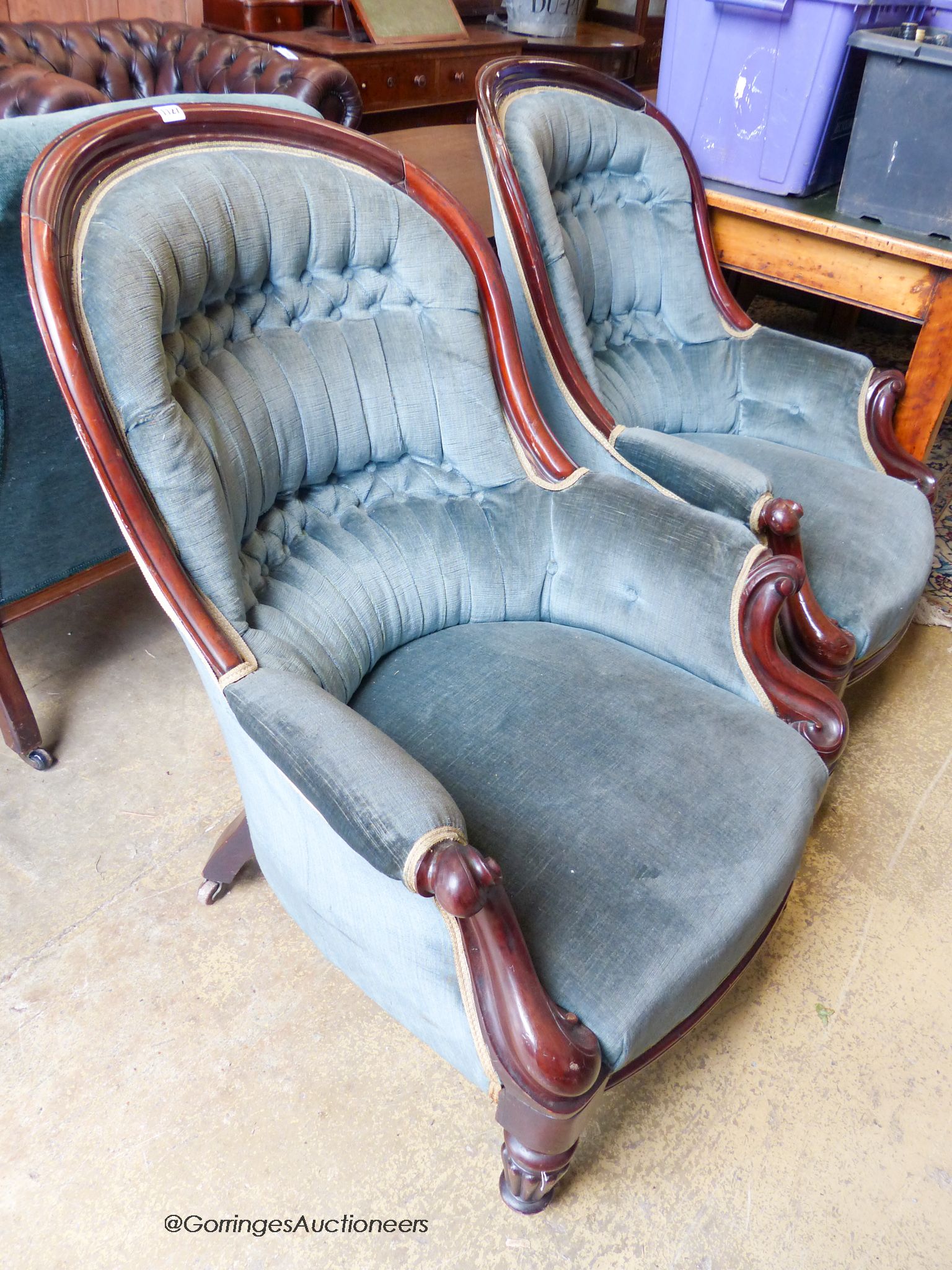 A pair of Victorian mahogany spoonback armchairs. W-71cm, D-84cm, H-95cm.